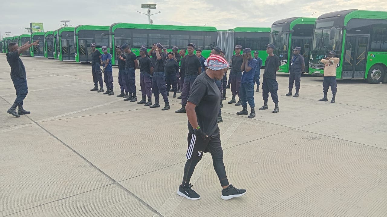 HKB officers lined up in front of BRT buses