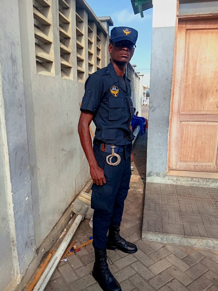 HKB officer in uniform carrying handcuffs on patrol