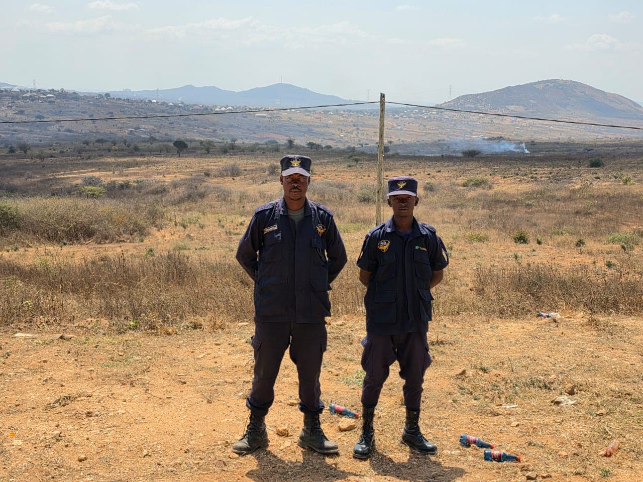 Two uniformed HKB officers standing at attention on post